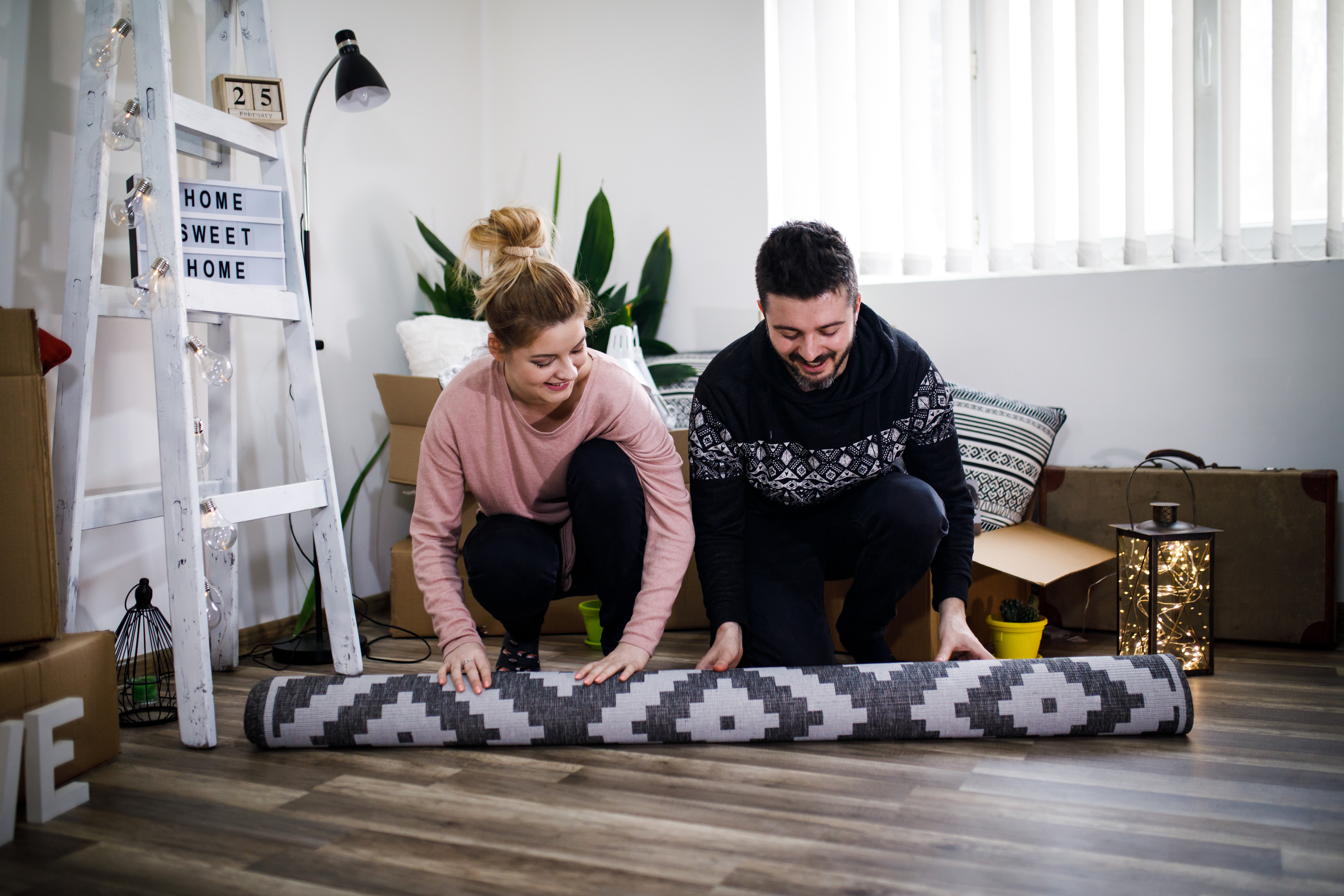 Placement de tapis de sol en bois franc